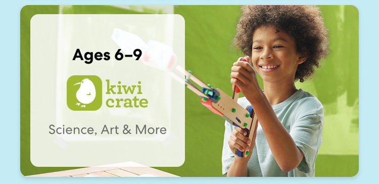 Young child smiling while working on a science experiment from KiwiCo Labs. Hands-on STEAM learning for ages 6–9