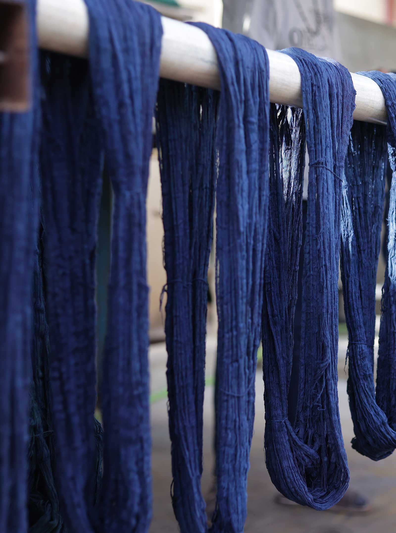blue yarns hanging to dry