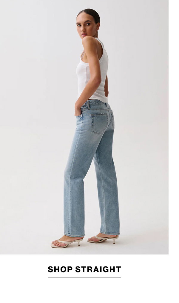 an image of a woman in jeans and a green shirt