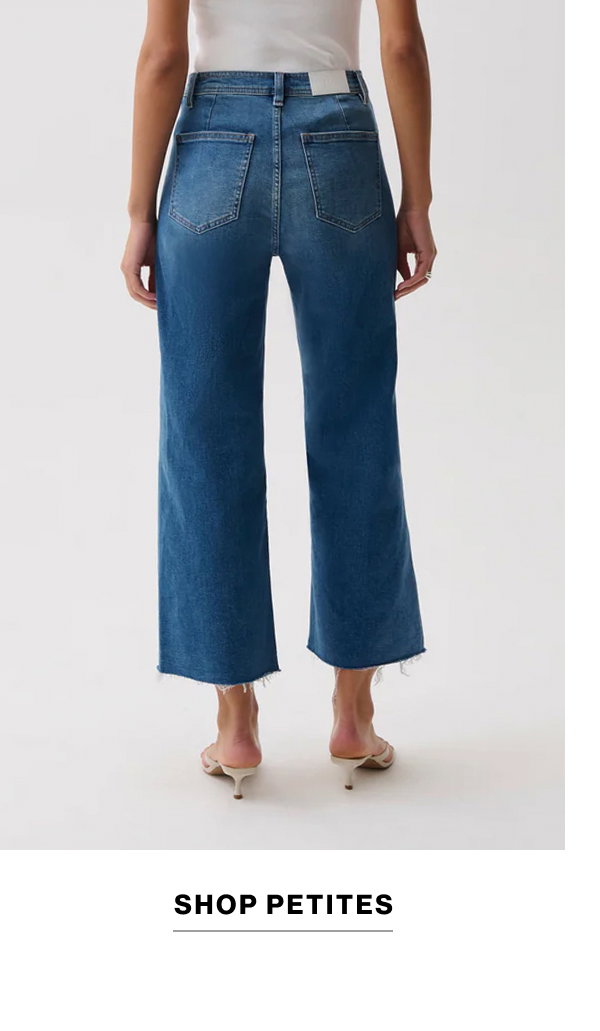an image of a woman in jeans and a green shirt