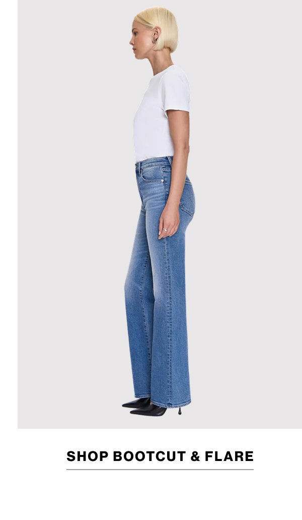 an image of a woman in jeans and a green shirt