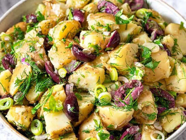 Greek potato salad in a sering bowl. 