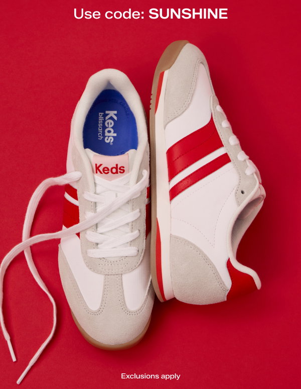 A red background features a pair of the Revival Nylon/Suede/Leather Lace-Up in snow white/neon red from a top-down view, one facing forward, one on its side.