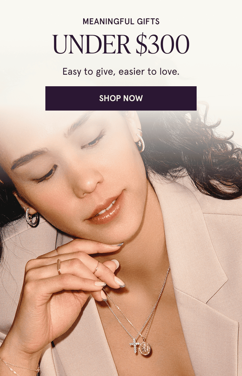 A model wearing gold gemstone jewelry. Meaningful gifts under $300. Click here to shop now