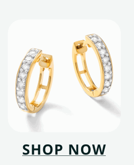 Gold hoops featuring a classic channel-set row of round stones along front. Click here to shop now