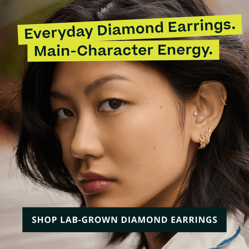 Model’s ear with geometrical gold-set diamond huggies & studs. Main-Character. Click here to shop lab-grown diamond earrings