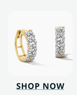 Gold huggies with a single row of vertically-set stones lining the front face. Click here to shop now