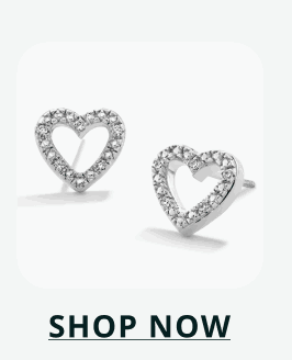 Silver studs designed as open heart frames lined with stones. Click here to shop now