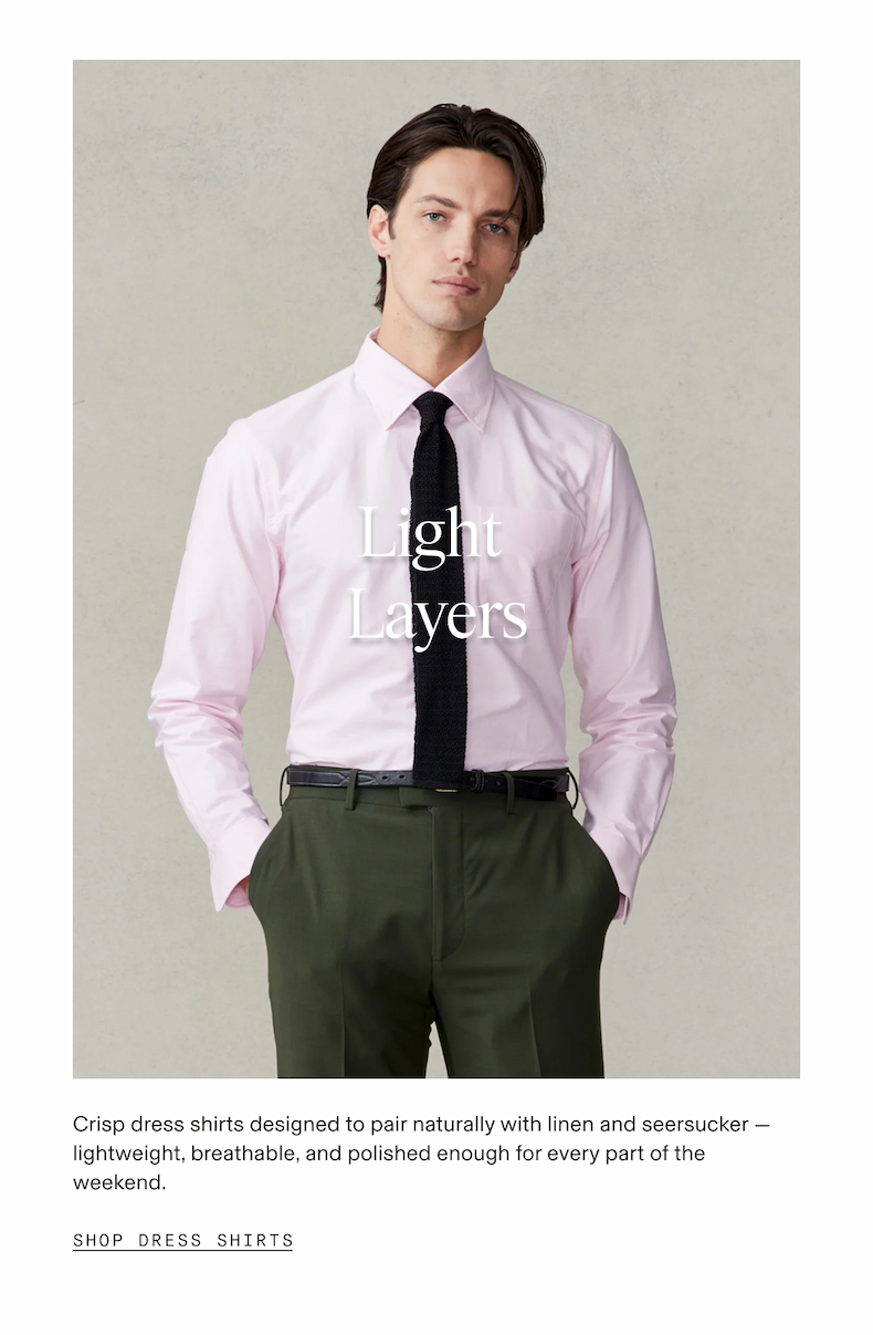 Man wearing a pink dress shirt with a black knit tie and olive trousers, hands in pockets against a neutral gray background. Light Layers. Crisp dress shirts designed to pair naturally with linen and seersucker — lightweight, breathable, and polished enough for every part of the weekend. SHOP DRESS SHIRTS