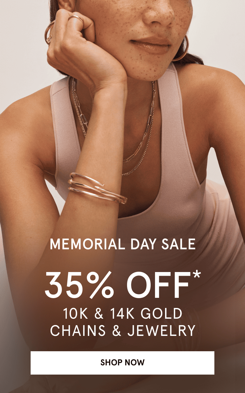 Woman wearing yellow gold hoops, chains, rings, and bangles. Memorial Day sale. 35% Off chains and jewelry. Click shop now.