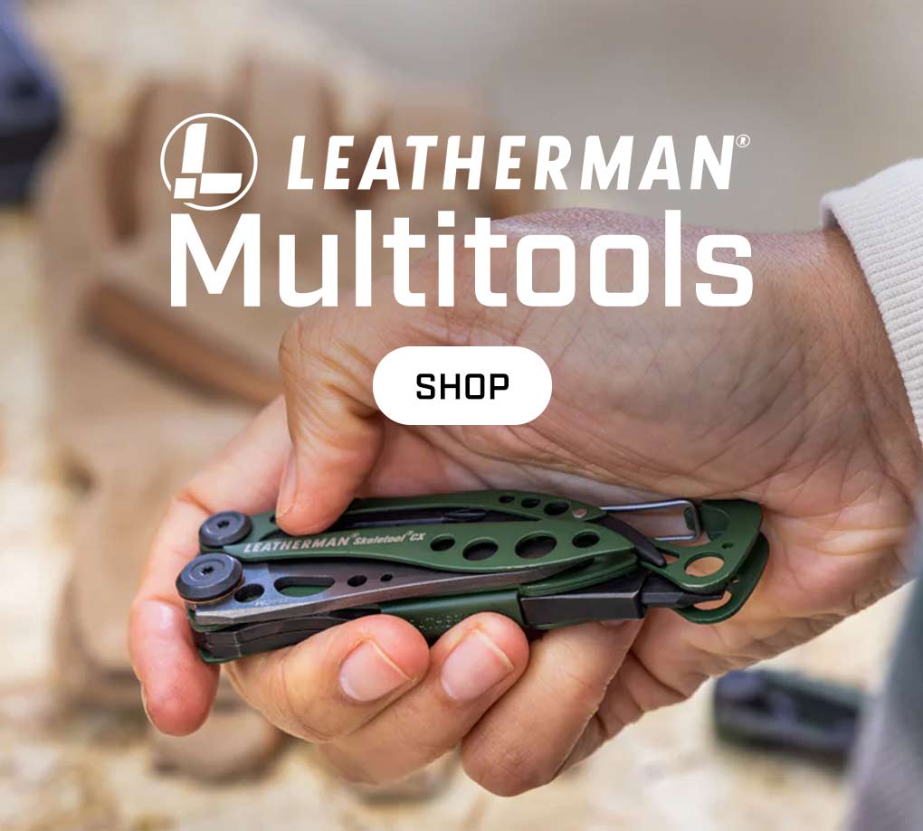 A man holding an army green leatherman multitool in his hand