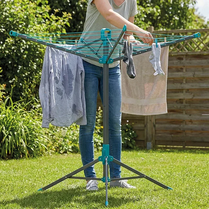 Person hanging clothes on 20M hip level airer in garden