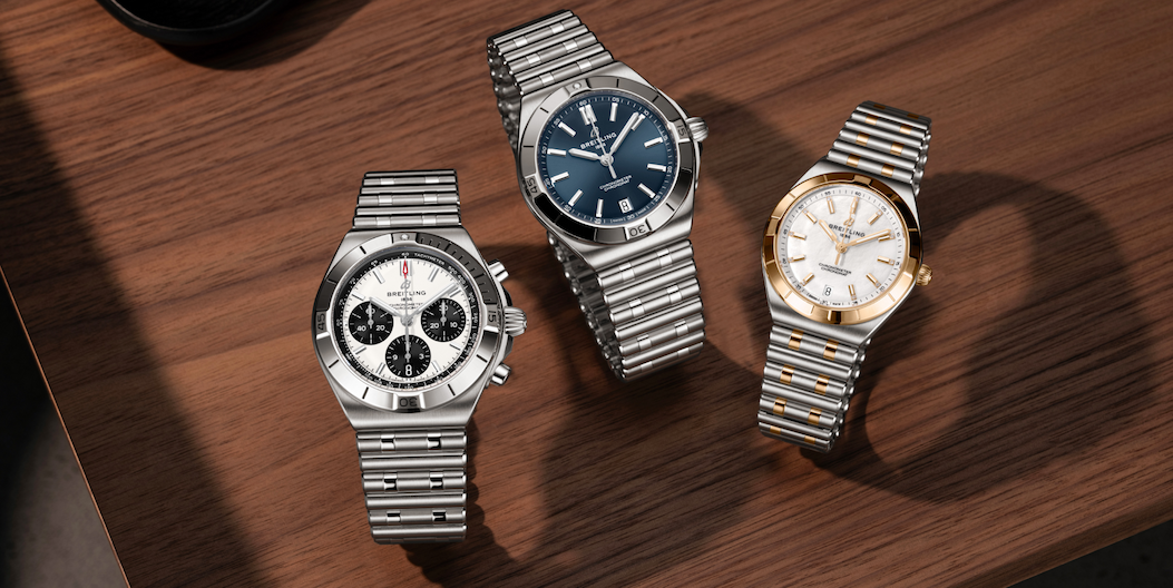 3 Breitling Chronomat watches on table