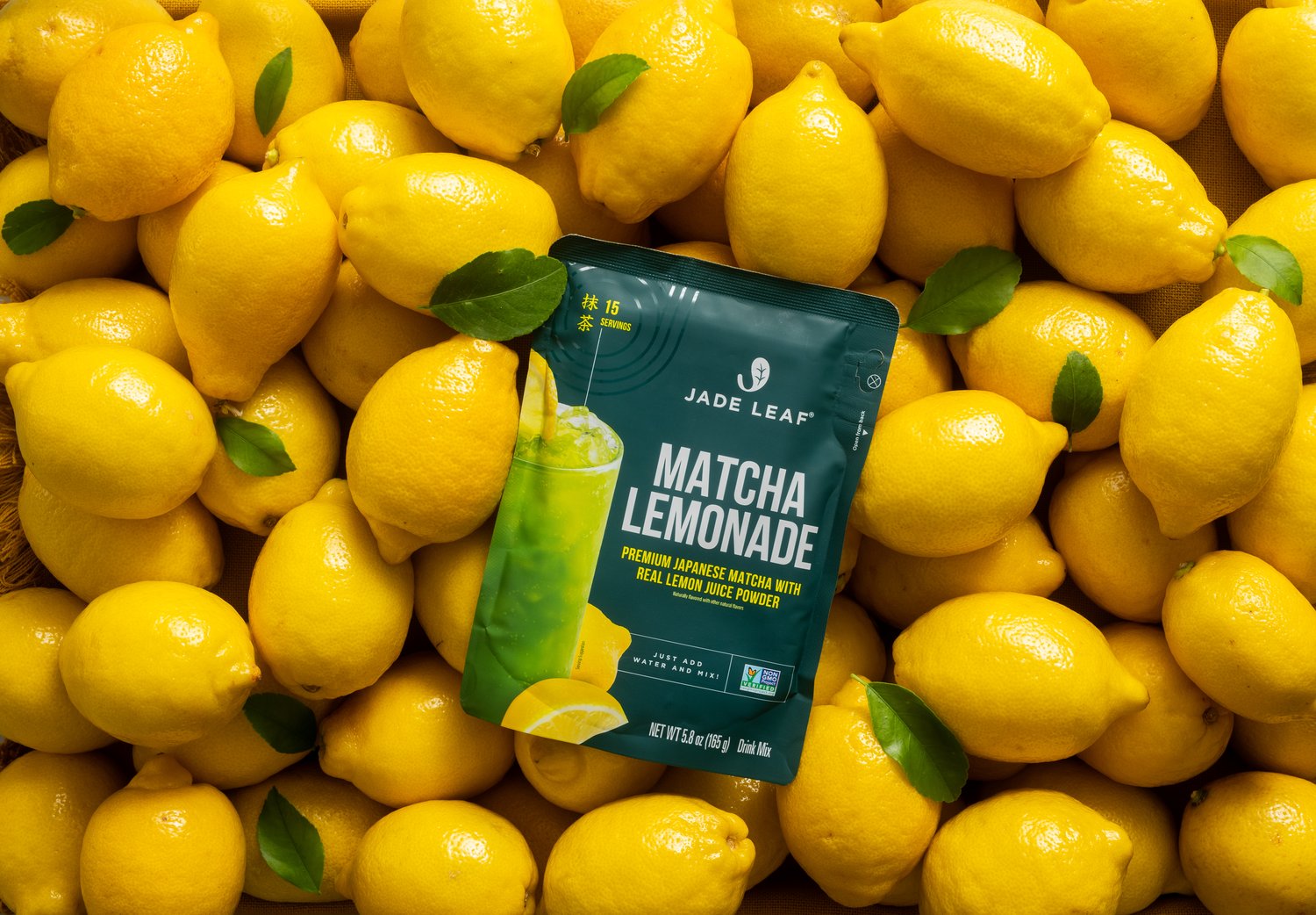 Matcha Lemonade Mix on a bed of fresh lemons