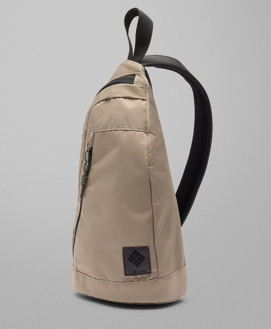 A tan cross-body bag against a grey background.