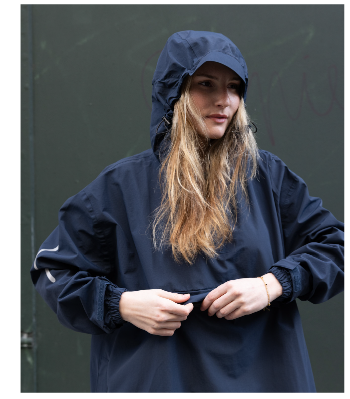 Woman wearing Stride Pullover Poncho in Navy