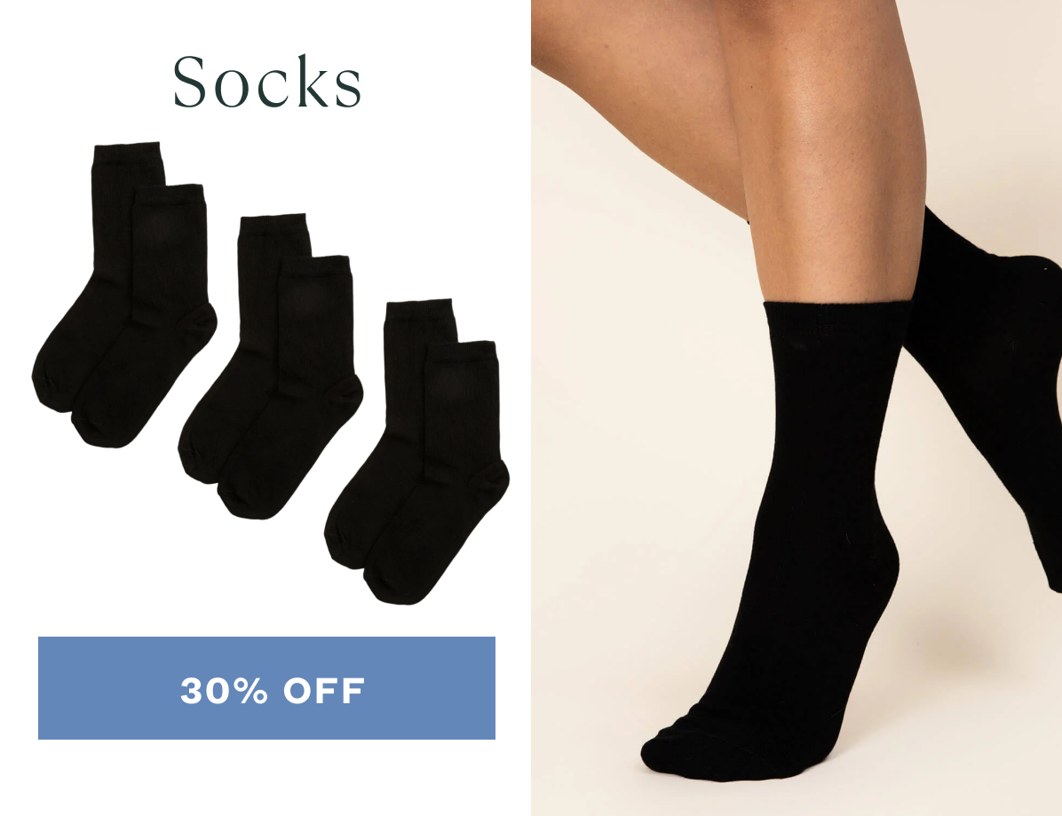 Model wearing Subset black socks. CTA: 30% Off
