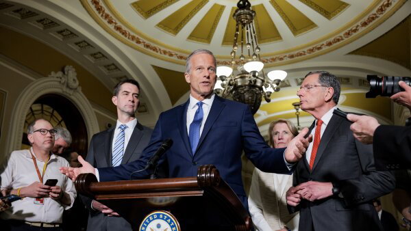 Senate Majority Leader John Thune, R-S.D., speaks at a podium to reporters in the Capitol on May 19.