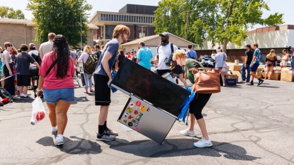 Illinois State University students getting items from the Front Yard Free-Cycle event.