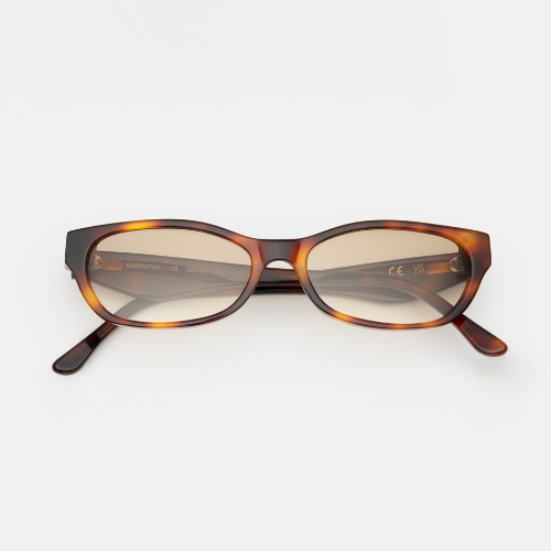A studio product shot of the Encinitas sunglasses. These feature a slim, elongated rectangular silhouette in a rich dark amber tortoise-shell acetate with light brown tinted lenses.