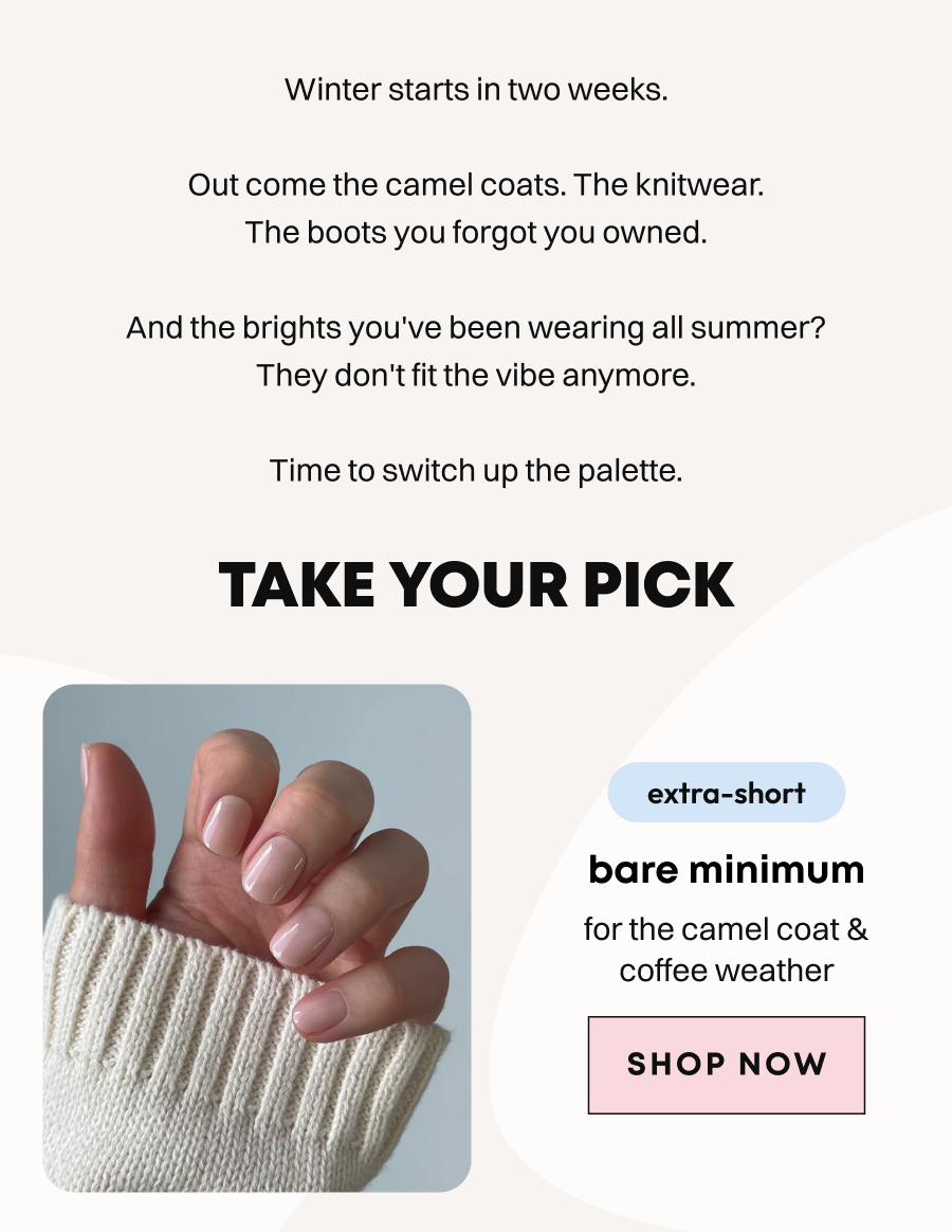 Hand wearing cream knitwear showing bare minimum nude press-on nails in natural pink shade