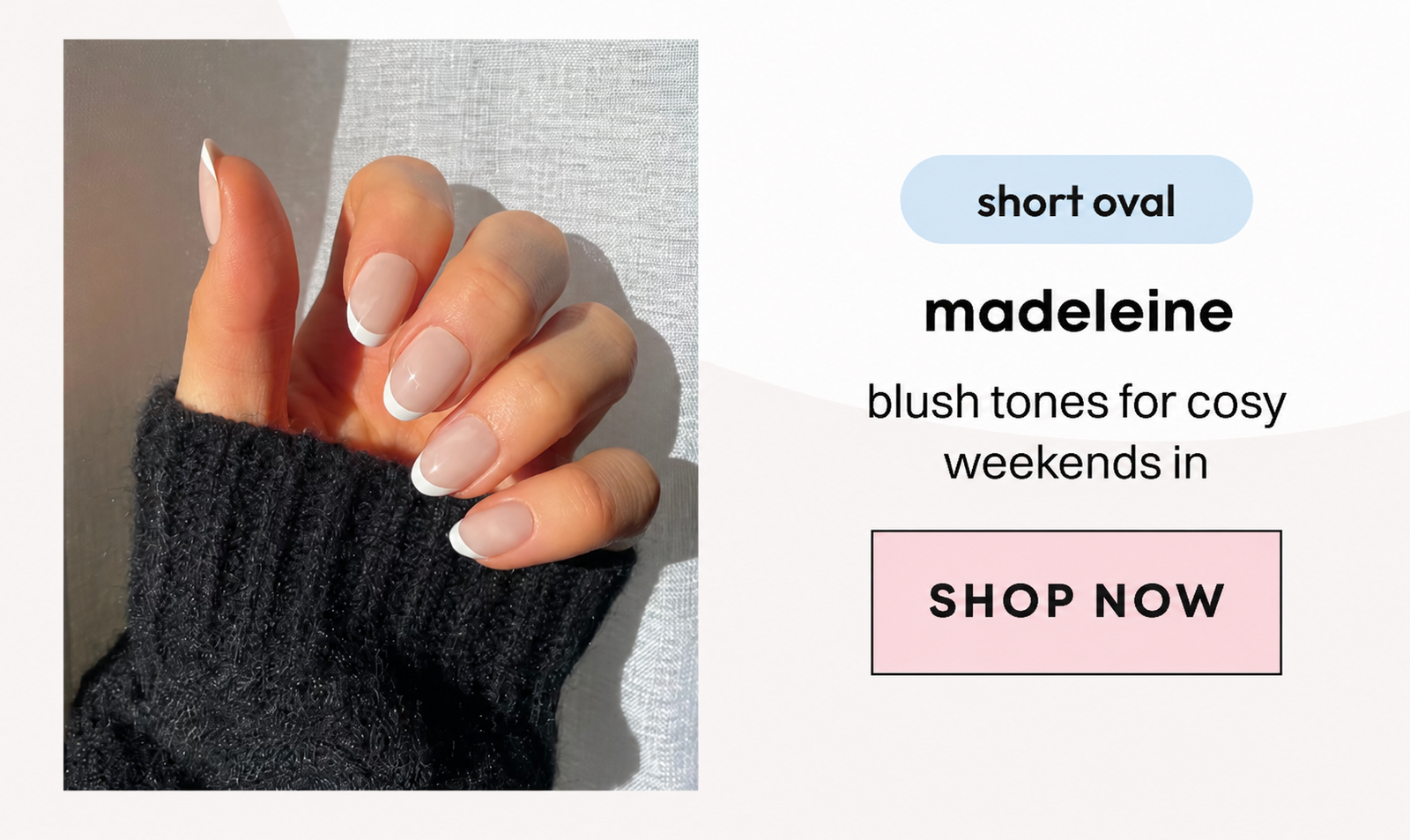 Hand in dark knitwear showing madeleine shade press-on nails in warm blush tone