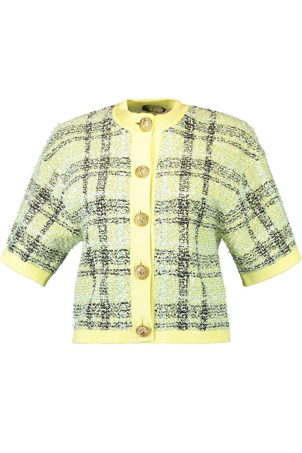 Image of buttoned shiny top