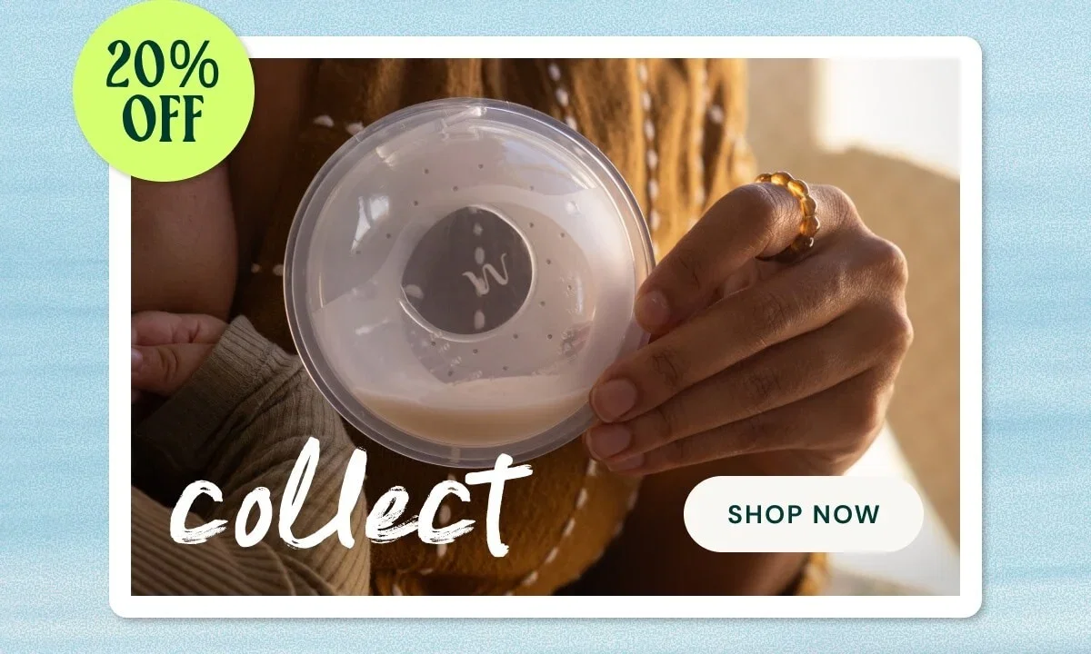 Woman holding breast milk collector cup