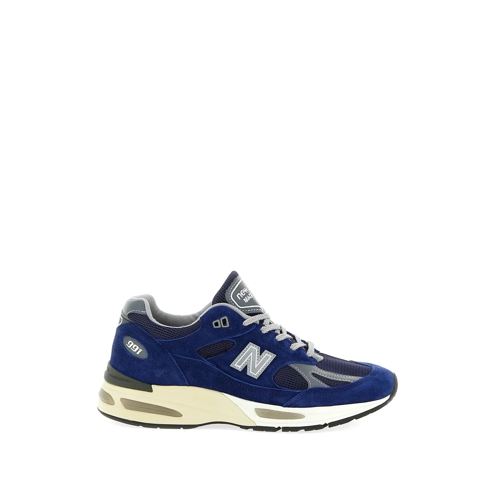 New Balance 991 navy suede and mesh trainer, side profile on white background