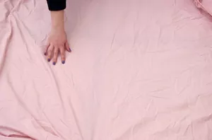 Spread an old fitted sheet on your floor for designer floor decor