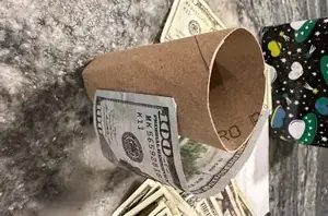 Stick dollar bills to an empty toilet paper roll for this super-fun gift idea