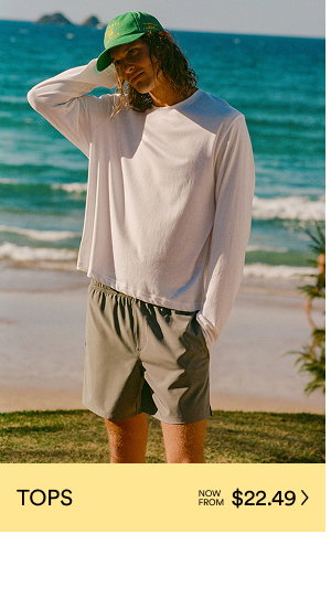 Man wearing white long sleeve shirt and shorts on beach, TOPS from $22.49