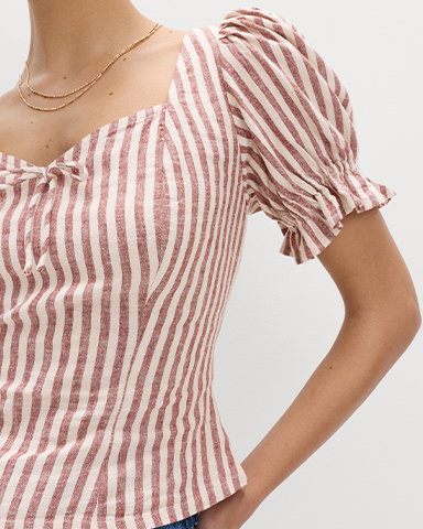Woman wearing a Brown Mix Linen Rich Printed Sweetheart Neck Top