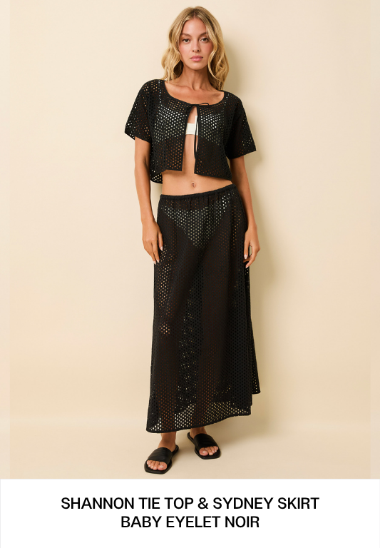 Woman Wearing Black Top and Skirt
