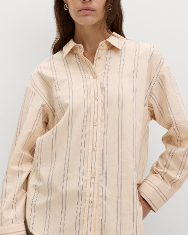 Woman wearing a Natural Mix Striped Collared Shirt with Linen
