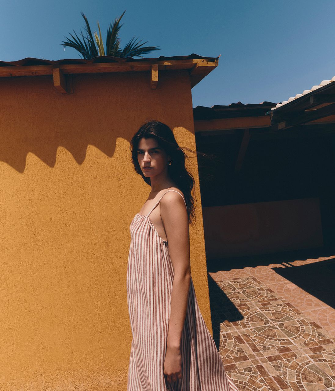 Woman wearing a Brown Mix Linen Rich Striped Maxi Slip Dress
