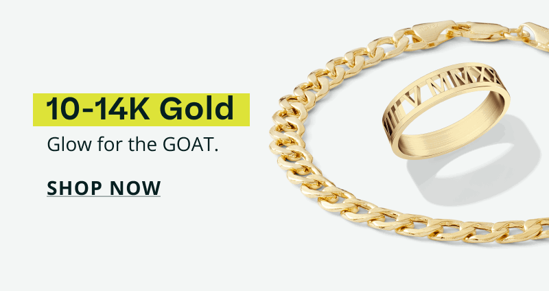 Gold band featuring Roman numerals & a gold curb-link chain bracelet.10-14K gold. Glow for the goat. Click here to shop now