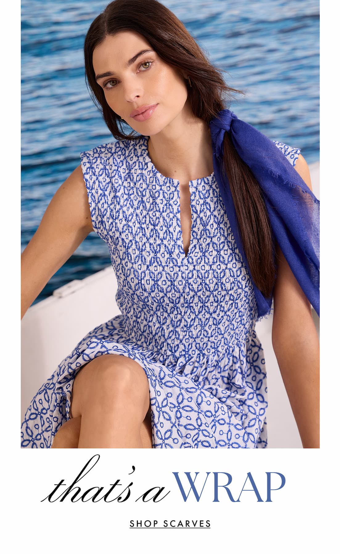 That's a wrap. Shop scarves. The lady wearing the Meg Cohen Cashmere Neck Scarf and Embroidered Tile Amelia Dress.