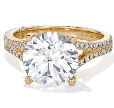 Yellow gold round diamond solitaire ring with double pavé band and four-prong setting.