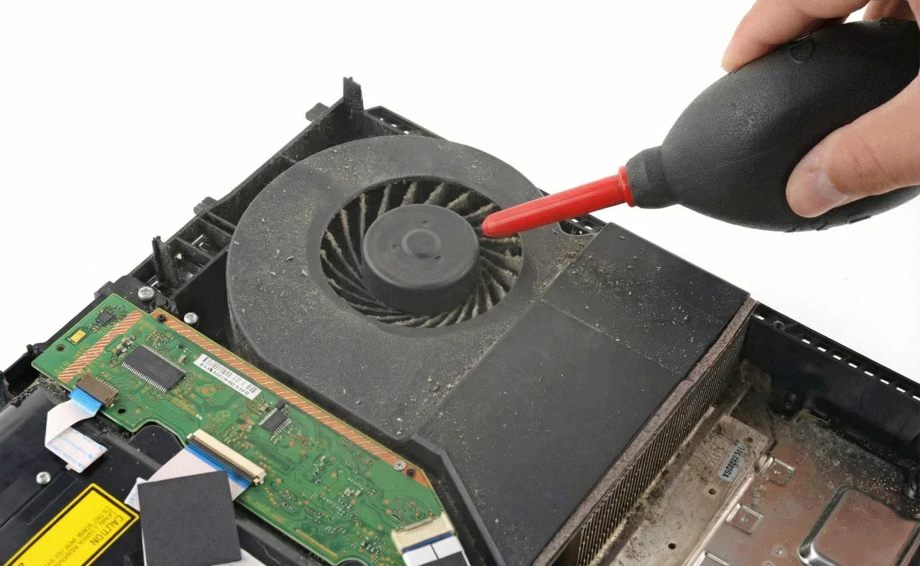 Gif of a dust blower cleaning a dirty laptop fan