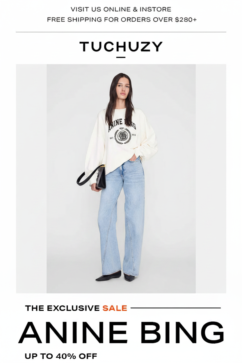Anine Bing sale on Tuchizy featuring a model in a sweatshirt and jeans.