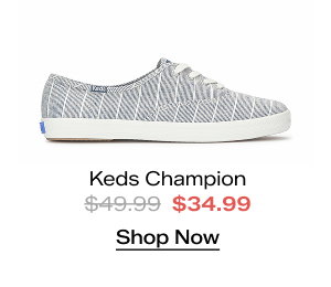 A side view of the Keds Champion Chambray Lurex Stripe Lace-Up in vintage indigo. The style was $49.99 and is now $34.99 for a limited time. Shop Now.