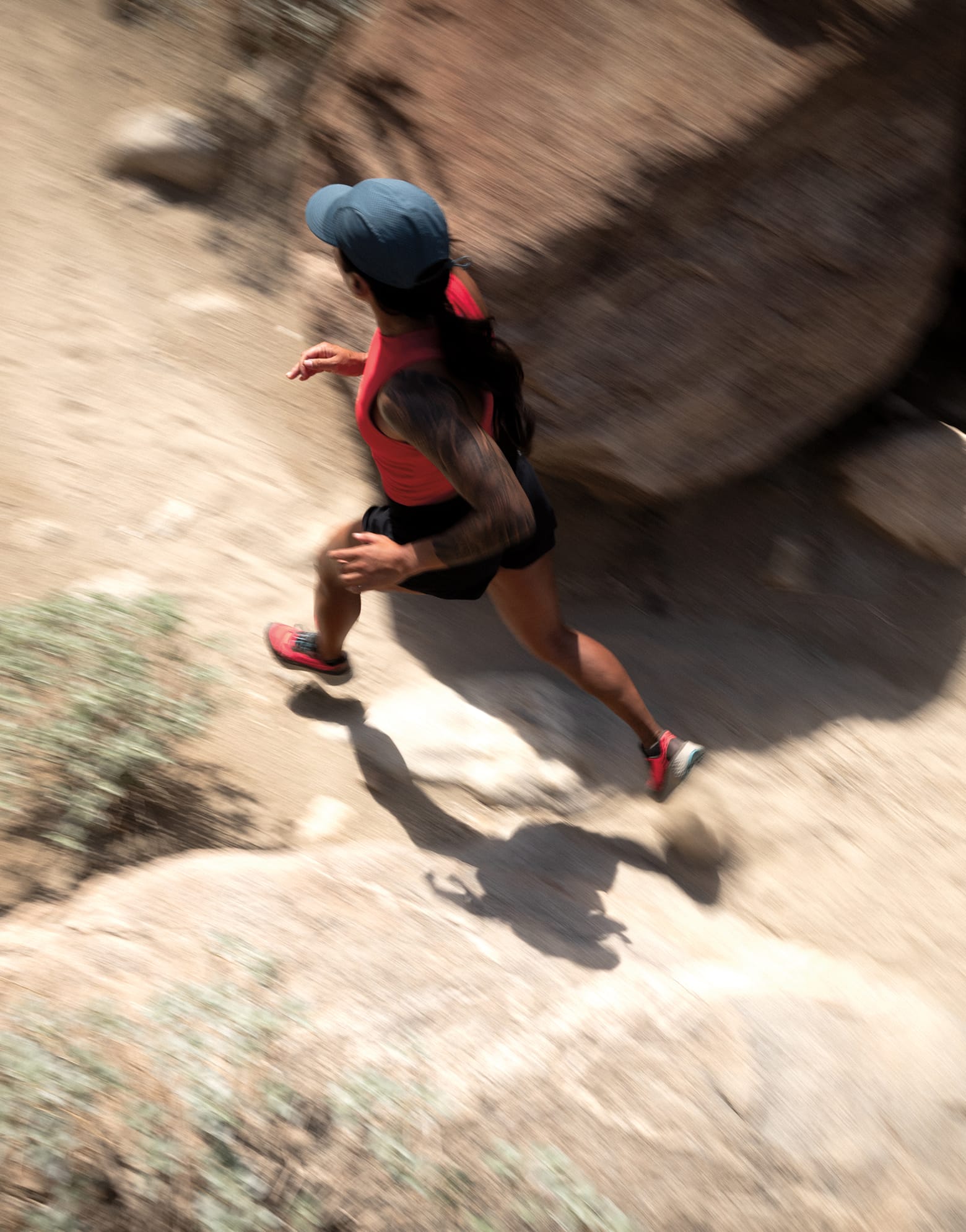 A woman trail running in Columbia gear. 