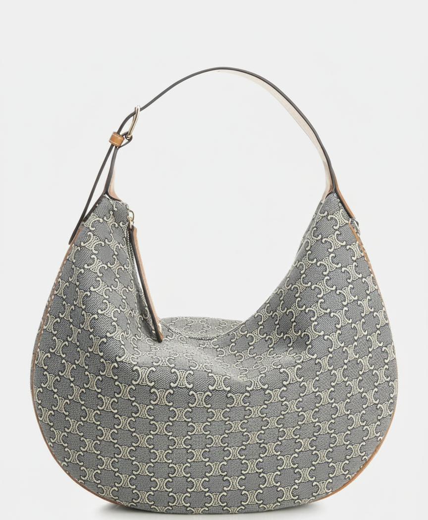 A grey hobo bag with a repeating white logo pattern and brown trim.