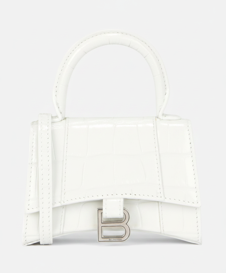 White Balenciaga Hourglass handbag with a silver B logo.