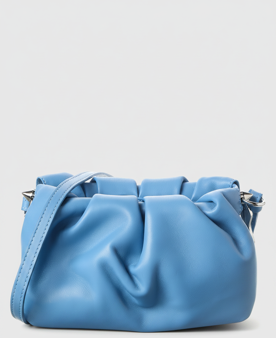 A blue leather drawstring handbag with a single strap and silver hardware.