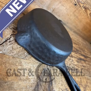So cool! The "hammered ugly" #5 cast iron skillet.  Maker Unknown, great for sides!
