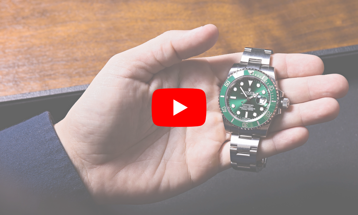 Hand holding Rolex watch