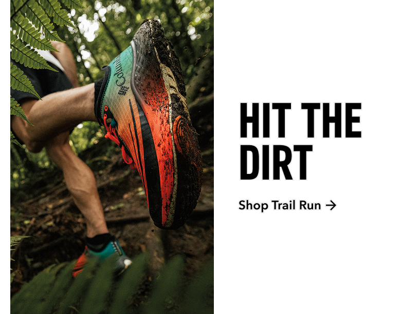 Shop trail run. Hit the dirt. Someone running a muddy trail.