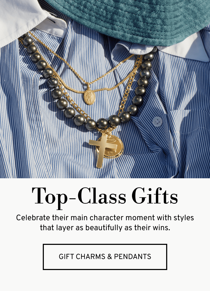 Layered necklaces over a shirt and hat. Top‑Class Gifts. Celebrate their moment in style. Click to Gift Charms & Pendants